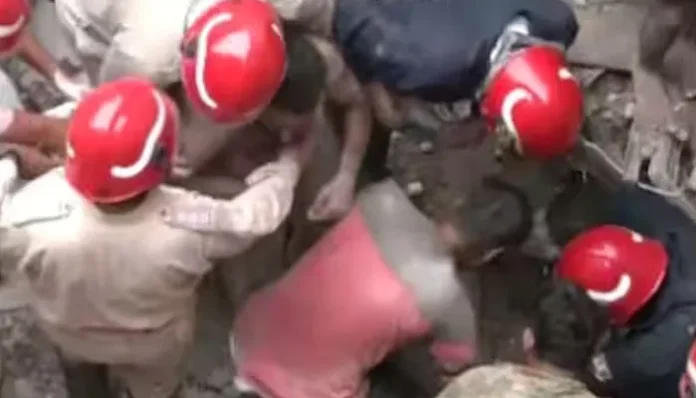 Two-story building collapses; many trapped, 12 people rescued